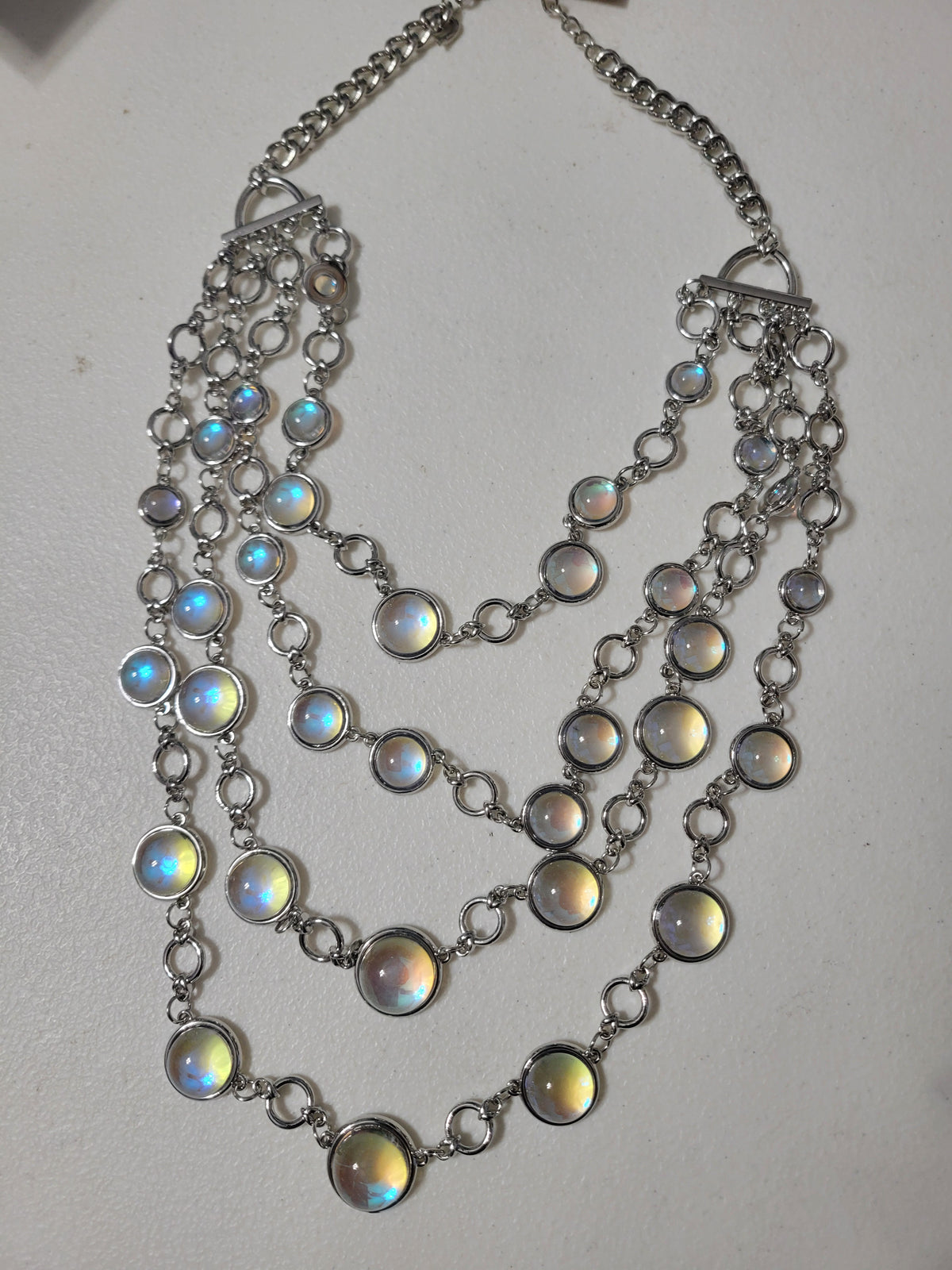 Clear iridescent stones that catch every color in the light. A simple, classy statement piece, and so pretty!