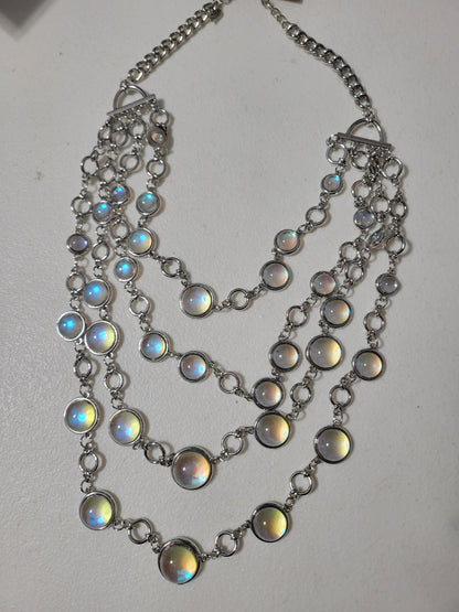 Clear iridescent stones that catch every color in the light. A simple, classy statement piece, and so pretty!